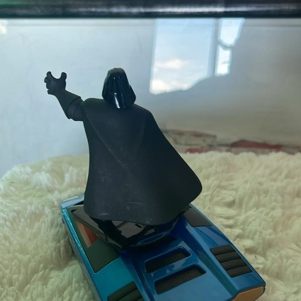 Darth Vader Figure on Blue Car